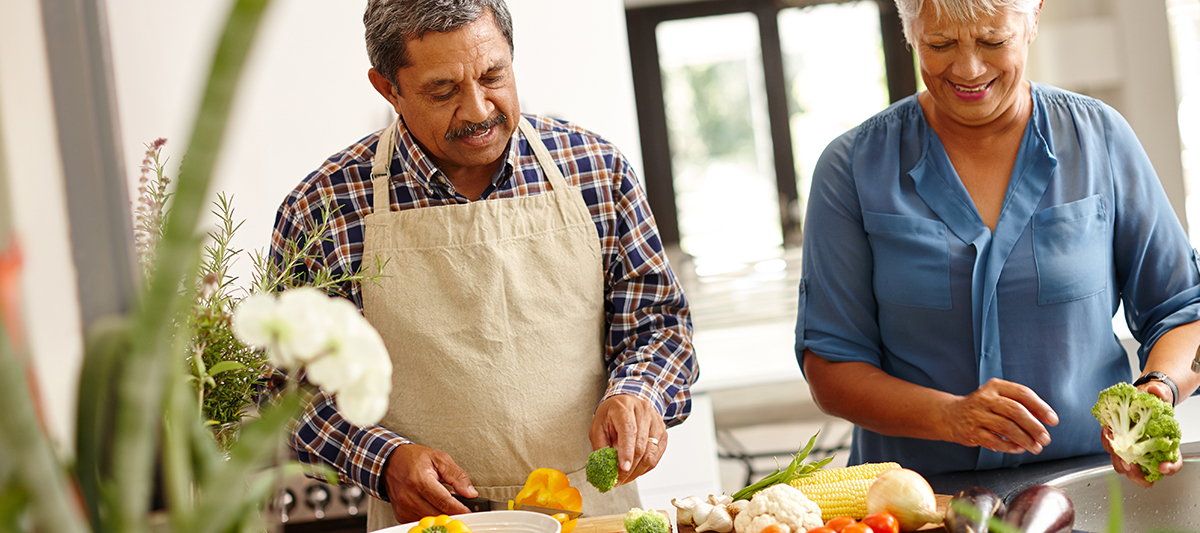 hispanic couple making food